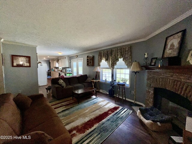 22541 Henry St, Laurel Hill, NC 28351 - living room with ornamental molding, a textured ceiling, wood finished floors, a fireplace with raised hearth, and baseboards