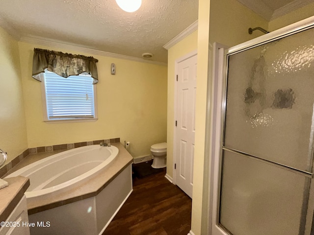 22541 Henry St, Laurel Hill, NC 28351 - bathroom featuring a bath, a shower stall, ornamental molding, wood finished floors, and toilet
