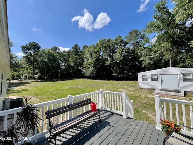 22541 Henry St, Laurel Hill, NC 28351 - deck with a yard, an outbuilding, central AC unit, and view of scattered trees
