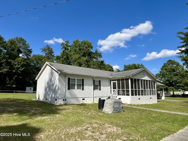 22541 Henry St, Laurel Hill, NC 28351 - rear view of house featuring a sunroom, crawl space, and roof with shingles