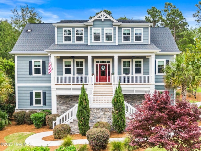 341 Bay Hill Ct, Shallotte, NC 28470 - view of front of house featuring stairs, covered porch, and stone siding