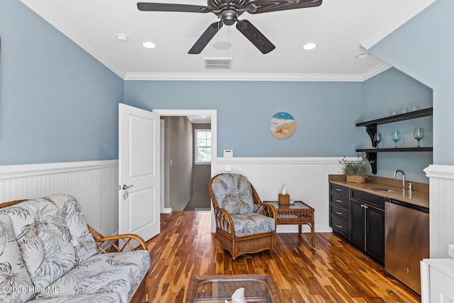 341 Bay Hill Ct, Shallotte, NC 28470 - living area with a wainscoted wall, a ceiling fan, wood finished floors, and crown molding