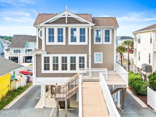 341 Bay Hill Ct, Shallotte, NC 28470 - back of house featuring stairs and roof with shingles