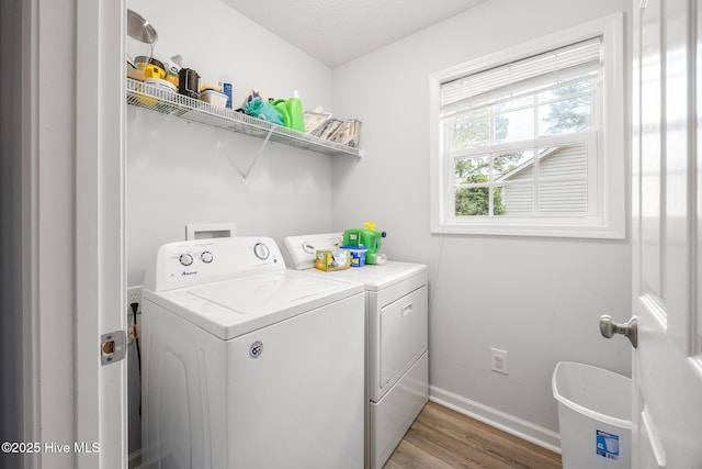 130 Woodgreen Ln, Aberdeen, NC 28315 - laundry room with separate washer and dryer, light wood finished floors, and baseboards