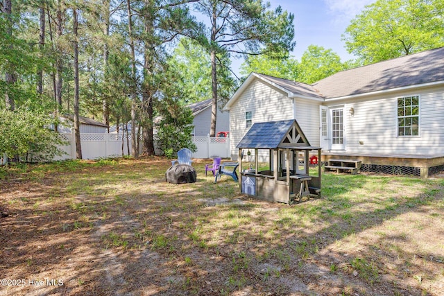 130 Woodgreen Ln, Aberdeen, NC 28315 - fenced backyard with a fire pit