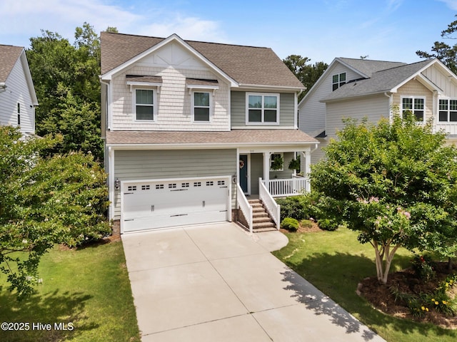 513 Belhaven Dr, Wilmington, NC 28411 - view of front of home featuring a porch, an attached garage, a front yard, concrete driveway, and a shingled roof