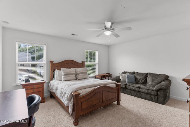 513 Belhaven Dr, Wilmington, NC 28411 - bedroom featuring light carpet, multiple windows, and a ceiling fan