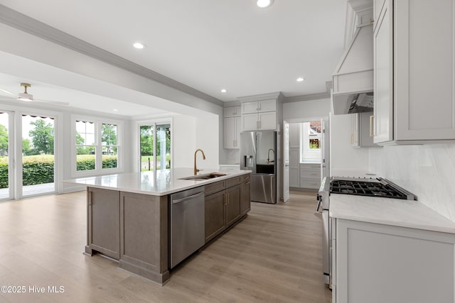 1401 Regatta Dr, Wilmington, NC 28405 - kitchen with stainless steel appliances, a sink, ornamental molding, a kitchen island with sink, and recessed lighting