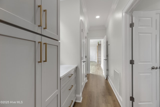 1401 Regatta Dr, Wilmington, NC 28405 - hallway featuring crown molding, wood finished floors, recessed lighting, and baseboards