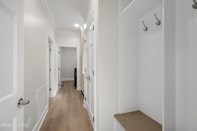 1401 Regatta Dr, Wilmington, NC 28405 - mudroom featuring light wood-style floors, crown molding, and recessed lighting