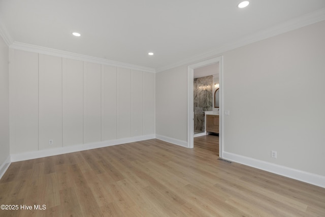 1401 Regatta Dr, Wilmington, NC 28405 - unfurnished room with light wood-style flooring, baseboards, ornamental molding, and recessed lighting