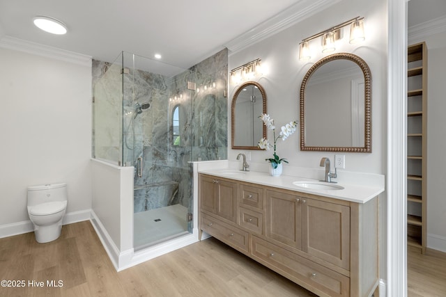 1401 Regatta Dr, Wilmington, NC 28405 - full bath with a marble finish shower, double vanity, wood finished floors, toilet, and crown molding