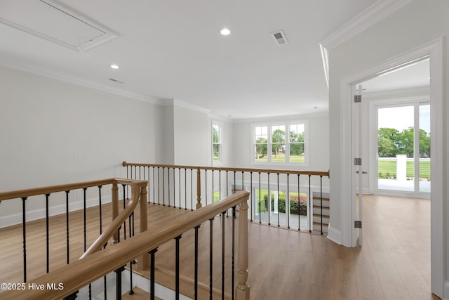 1401 Regatta Dr, Wilmington, NC 28405 - hallway with attic access, ornamental molding, recessed lighting, light wood-style floors, and baseboards