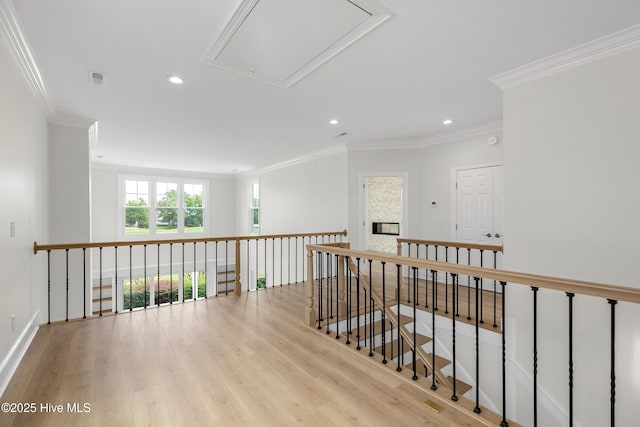 1401 Regatta Dr, Wilmington, NC 28405 - hallway featuring attic access, recessed lighting, wood finished floors, ornamental molding, and baseboards