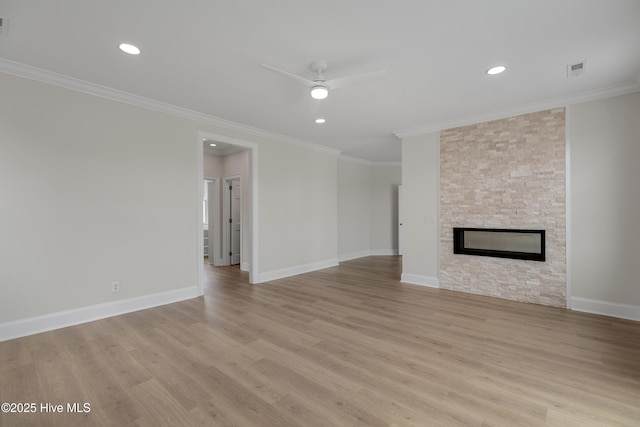 1401 Regatta Dr, Wilmington, NC 28405 - unfurnished living room with ceiling fan, light wood-style floors, ornamental molding, recessed lighting, and a fireplace