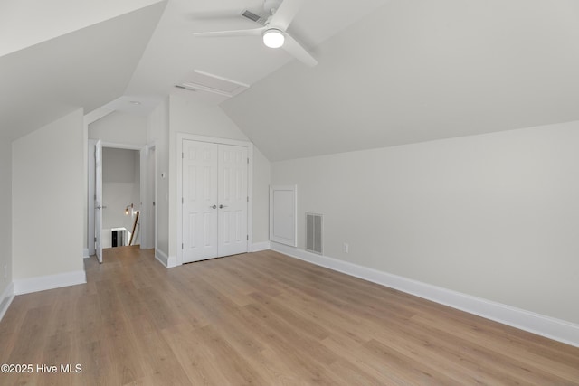 1401 Regatta Dr, Wilmington, NC 28405 - additional living space featuring vaulted ceiling, light wood-type flooring, a ceiling fan, and baseboards