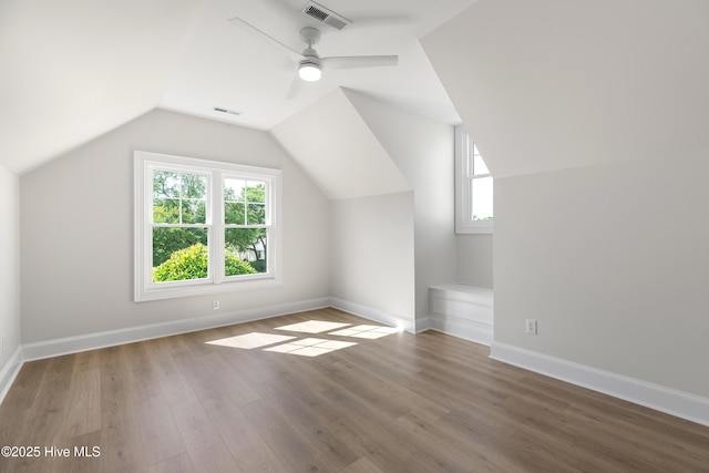 1401 Regatta Dr, Wilmington, NC 28405 - additional living space featuring healthy amount of natural light, wood finished floors, lofted ceiling, a ceiling fan, and baseboards