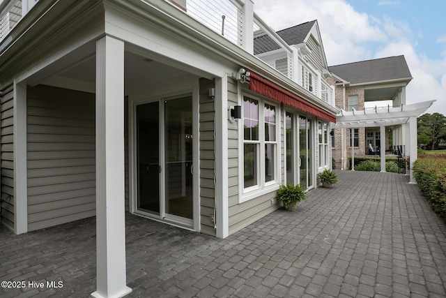 1401 Regatta Dr, Wilmington, NC 28405 - view of side of property featuring a patio area