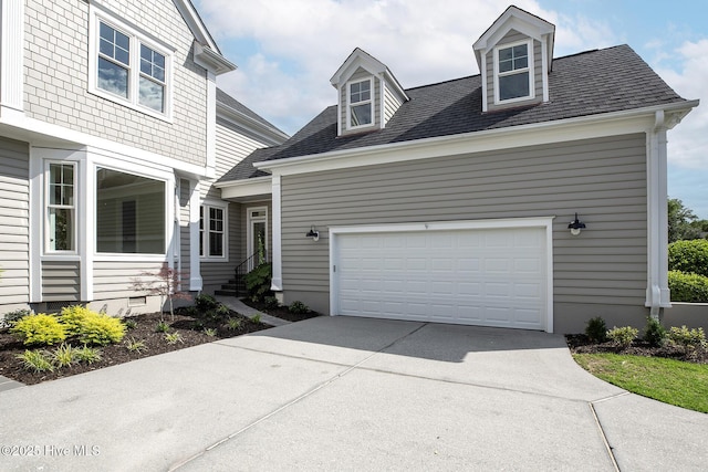 1401 Regatta Dr, Wilmington, NC 28405 - view of front of house featuring concrete driveway, roof with shingles, and an attached garage