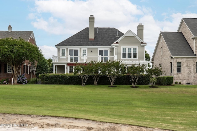 1401 Regatta Dr, Wilmington, NC 28405 - rear view of property featuring a lawn and a chimney