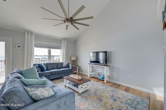 2006 N Shore Dr Unit B, Surf City, NC 28445 - living area with a ceiling fan, high vaulted ceiling, wood finished floors, and baseboards