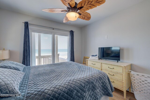 2006 N Shore Dr Unit B, Surf City, NC 28445 - bedroom with light wood finished floors, ceiling fan, and access to outside