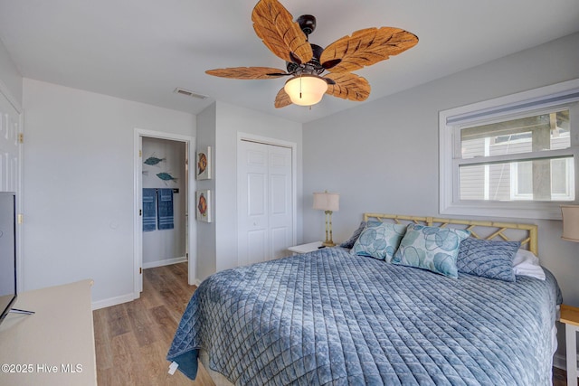 2006 N Shore Dr Unit B, Surf City, NC 28445 - bedroom with light wood-type flooring, a closet, baseboards, and a ceiling fan
