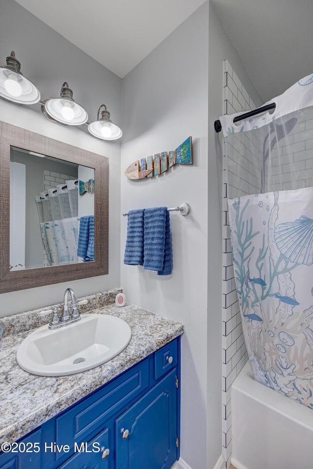 2006 N Shore Dr Unit B, Surf City, NC 28445 - bathroom with vanity and shower / bath combo with shower curtain