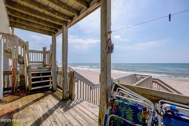 2006 N Shore Dr Unit B, Surf City, NC 28445 - wooden deck featuring stairs and view of water and beach