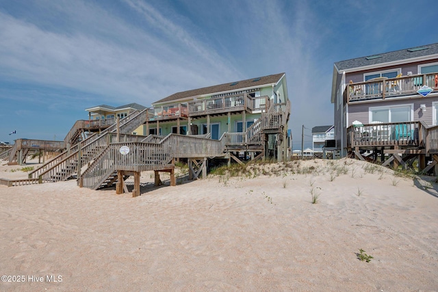 2006 N Shore Dr Unit B, Surf City, NC 28445 - back of property featuring stairs and a wooden deck