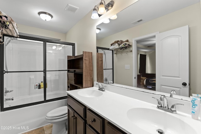 302 Boxwood Ct, Jacksonville, NC 28540 - bathroom featuring toilet, double vanity, and combined bath / shower with glass door