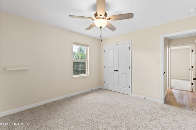 302 Boxwood Ct, Jacksonville, NC 28540 - unfurnished bedroom featuring carpet floors, baseboards, a closet, and ceiling fan