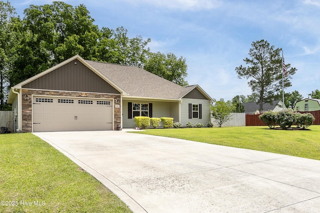 302 Boxwood Ct, Jacksonville, NC 28540 - ranch-style house with driveway, an attached garage, stone siding, board and batten siding, and a shingled roof