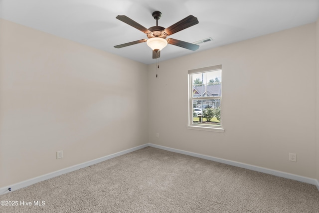 302 Boxwood Ct, Jacksonville, NC 28540 - empty room featuring carpet, baseboards, and a ceiling fan