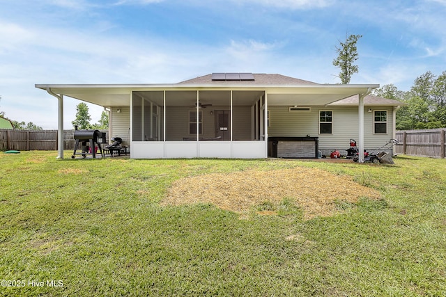 302 Boxwood Ct, Jacksonville, NC 28540 - back of property featuring a sunroom, roof mounted solar panels, a hot tub, roof with shingles, and ceiling fan