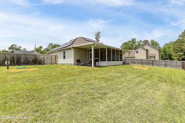 302 Boxwood Ct, Jacksonville, NC 28540 - back of house with a sunroom and roof mounted solar panels