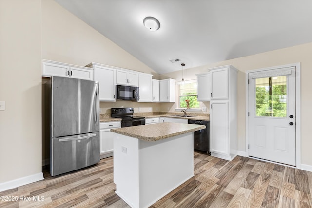302 Boxwood Ct, Jacksonville, NC 28540 - kitchen featuring black appliances, white cabinetry, a sink, lofted ceiling, and light countertops