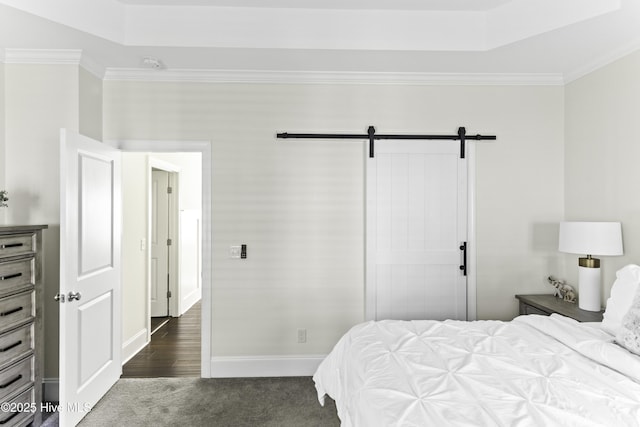 2212 Lakeside Cir, Wilmington, NC 28401 - bedroom featuring ornamental molding, dark carpet, a raised ceiling, and a barn door