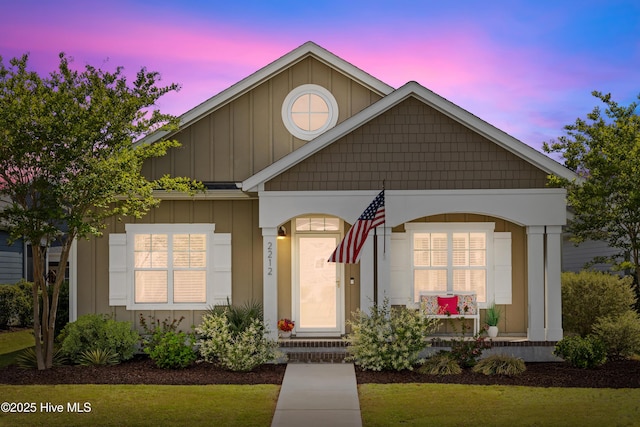 2212 Lakeside Cir, Wilmington, NC 28401 - view of front of home featuring board and batten siding and a porch