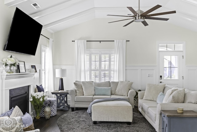 2212 Lakeside Cir, Wilmington, NC 28401 - living room with a wainscoted wall, ceiling fan, vaulted ceiling, dark wood-style floors, and healthy amount of natural light