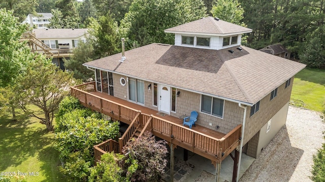 1005 Pirate Cove Cir, Oriental, NC 28571 - back of house featuring roof with shingles, a deck, stairs, and a yard
