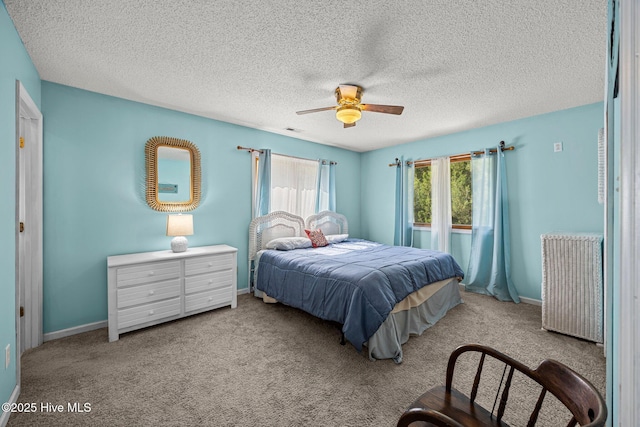 1005 Pirate Cove Cir, Oriental, NC 28571 - bedroom with a textured ceiling, carpet, ceiling fan, and baseboards