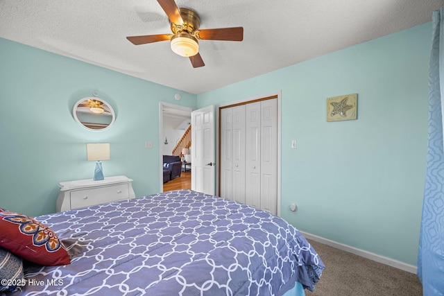 1005 Pirate Cove Cir, Oriental, NC 28571 - carpeted bedroom with a closet, a ceiling fan, a textured ceiling, and baseboards