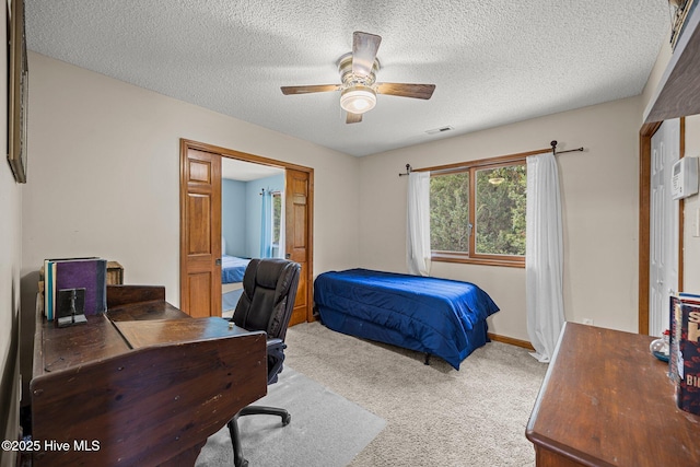 1005 Pirate Cove Cir, Oriental, NC 28571 - bedroom featuring carpet, a desk, a textured ceiling, a ceiling fan, and baseboards
