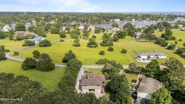 1005 Pirate Cove Cir, Oriental, NC 28571 - aerial view of residential area featuring a nearby body of water and a tree filled landscape