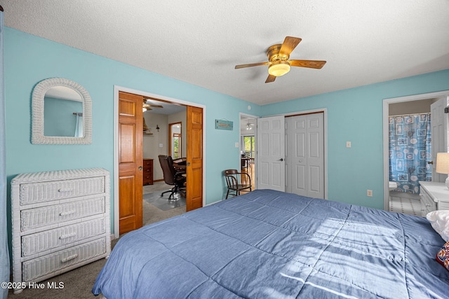 1005 Pirate Cove Cir, Oriental, NC 28571 - bedroom featuring carpet floors, a closet, a ceiling fan, an office area, and ensuite bath