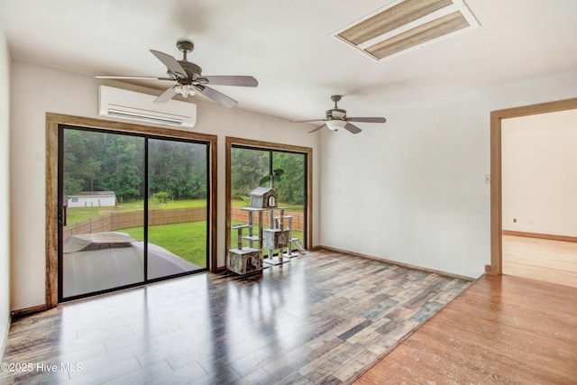 4969 Redman Rd, Rocky Mount, NC 27803 - empty room featuring an AC wall unit, wood finished floors, and ceiling fan