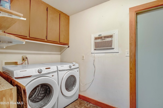 4969 Redman Rd, Rocky Mount, NC 27803 - washroom featuring washer and dryer, a wall unit AC, cabinet space, and baseboards