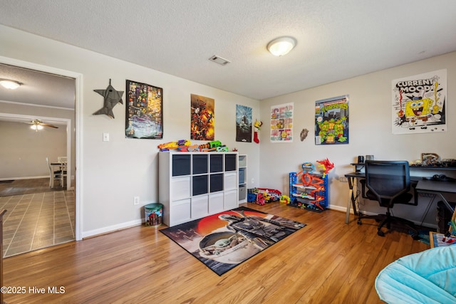 460 S NC-111 Hwy, Chinquapin, NC 28521 - recreation room with wood finished floors, a textured ceiling, baseboards, and an office area