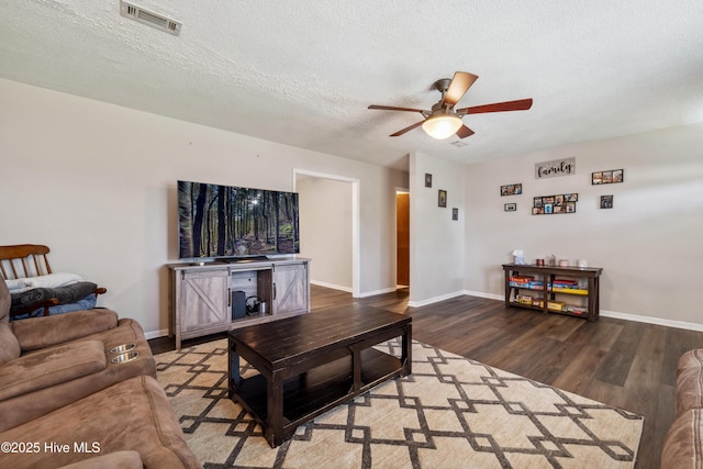 460 S NC-111 Hwy, Chinquapin, NC 28521 - living area featuring ceiling fan, wood finished floors, baseboards, and a textured ceiling